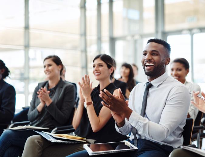 Group of businesspeople clapping 